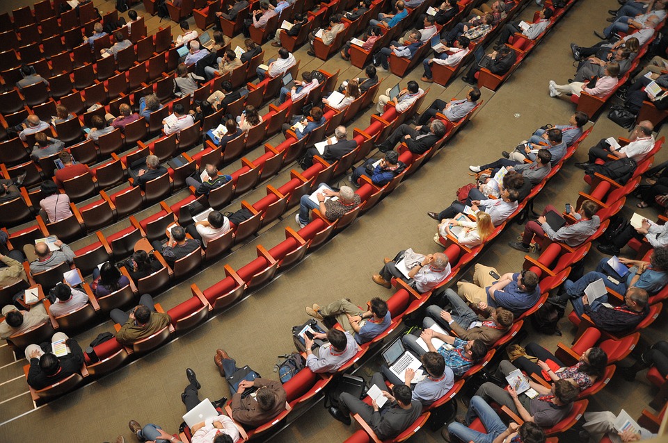 Attendees in a conference